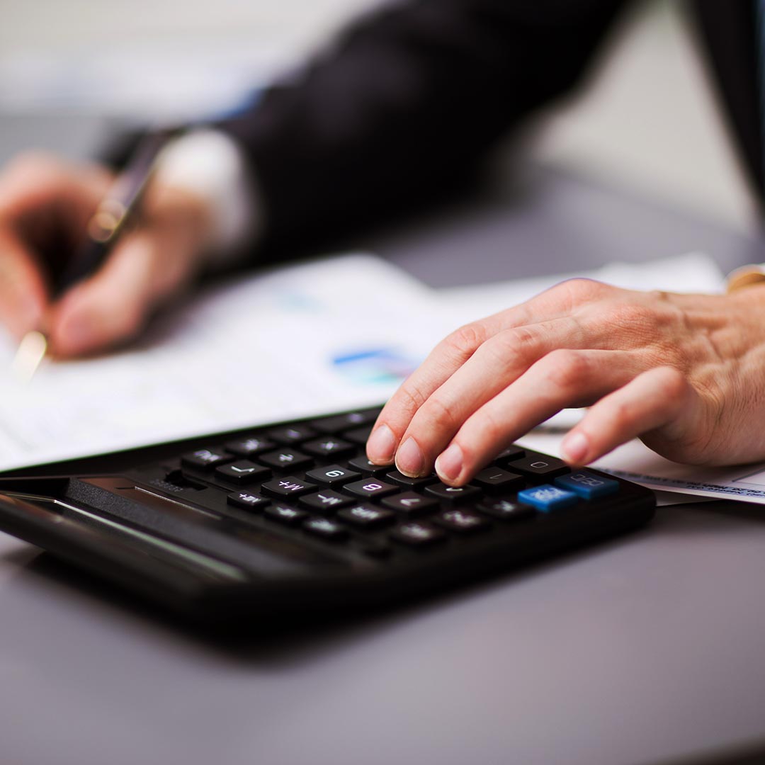 Accountant using a calculator
