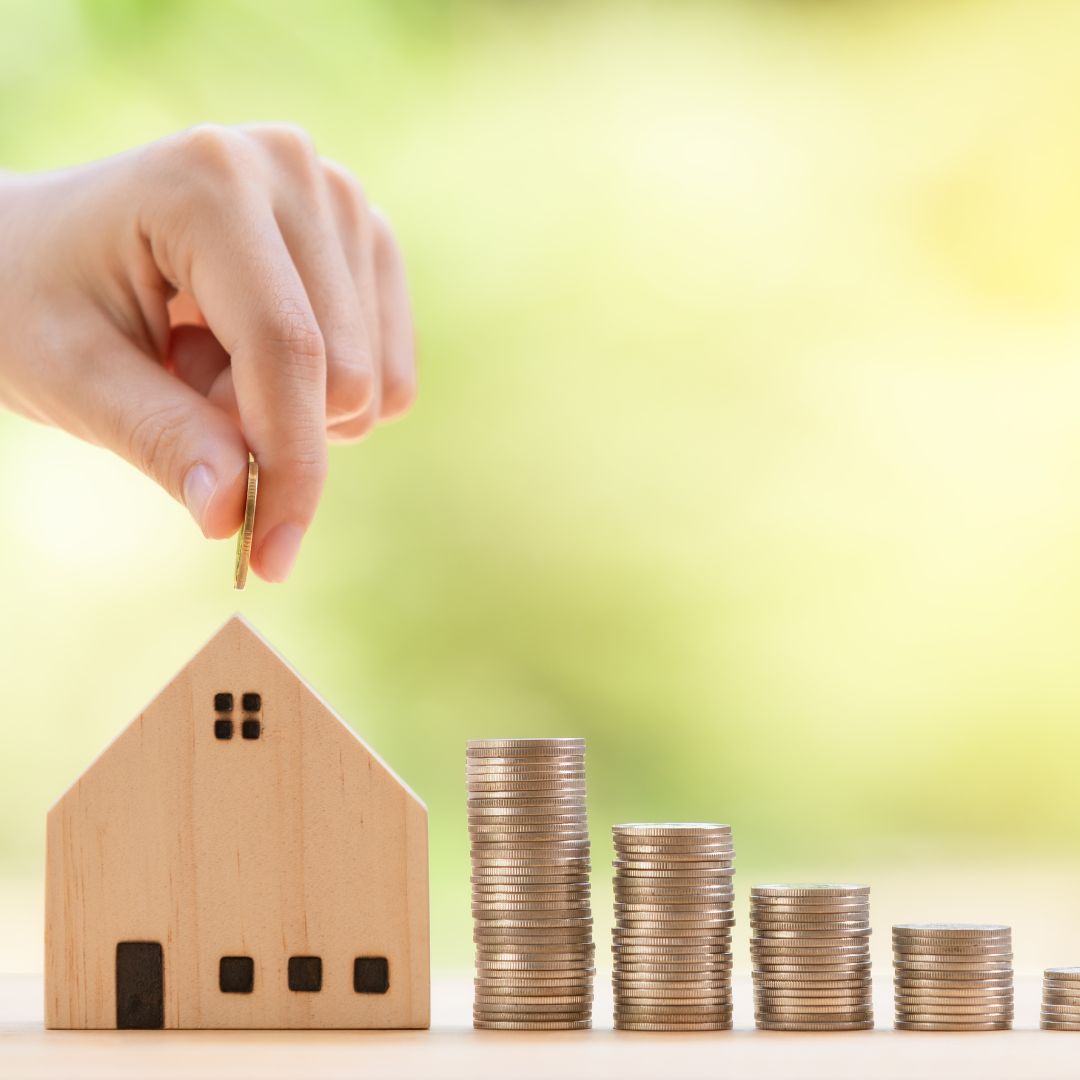 a home with increasing stacks of money leading to it