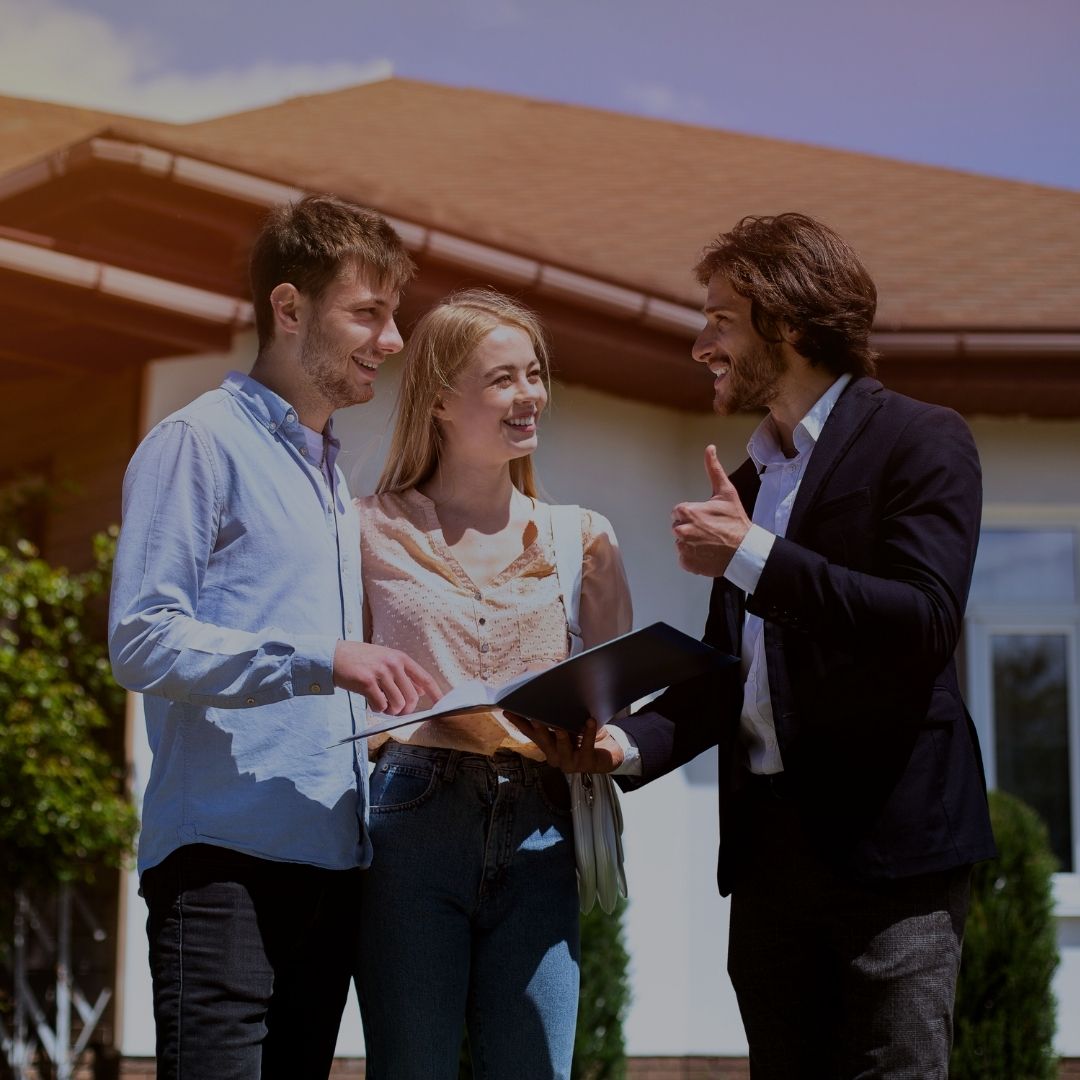 A person discussing a home with a couple