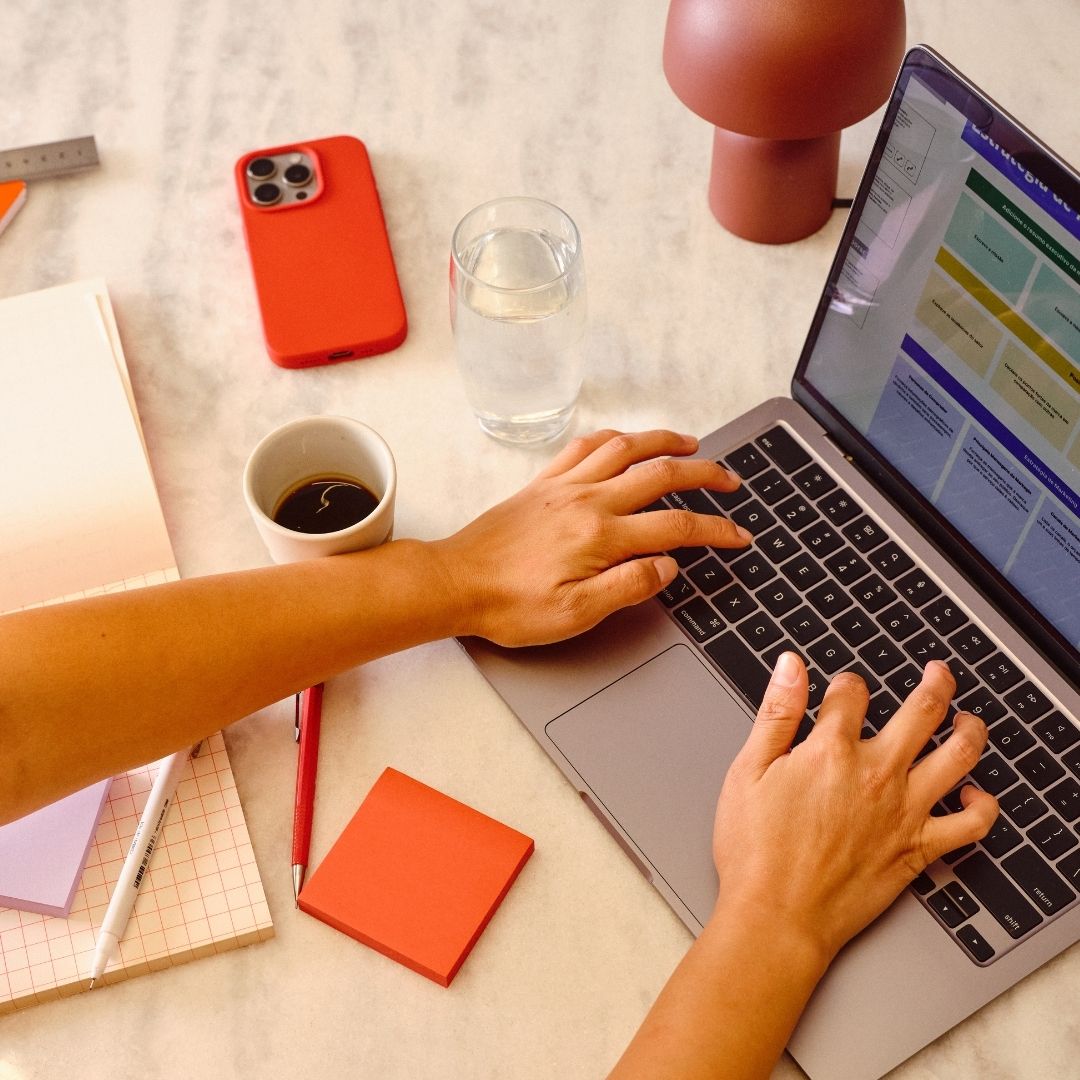 person typing on laptop